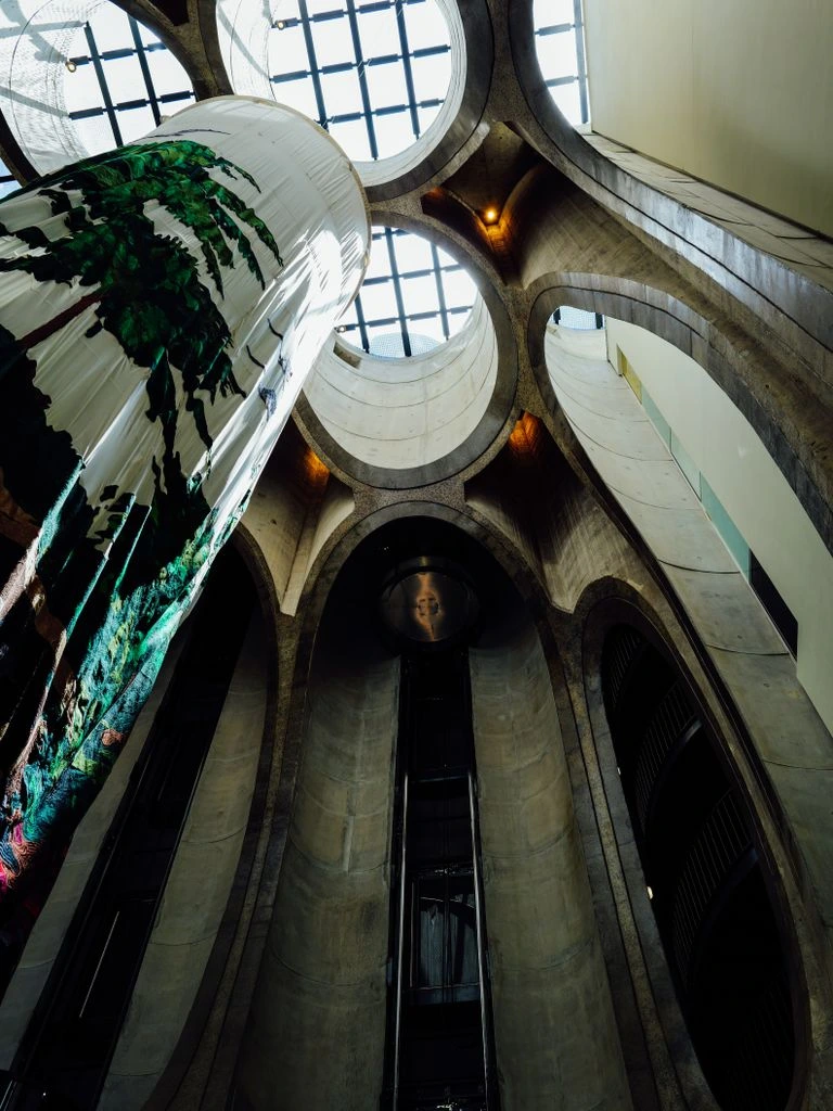 Atrium projection viewed from the ground floor of a contemporary museum.